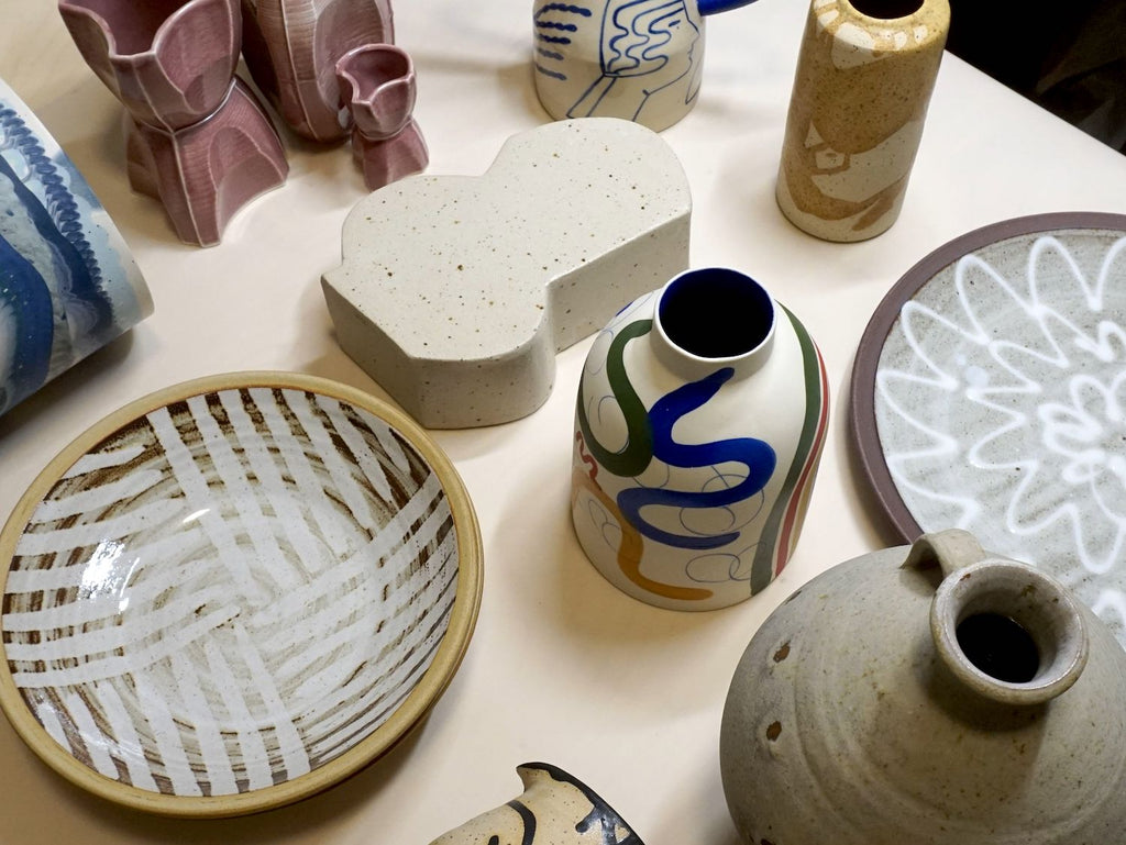 collection of handmade ceramics vases and plates. 