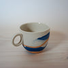 marbled blue and orange slipcast handmade espresso cup by anna jones ceramics. 