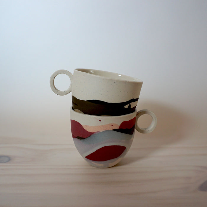 two dreamland slipcast porcelain espresso cups by anna jones ceramics in a stack. 