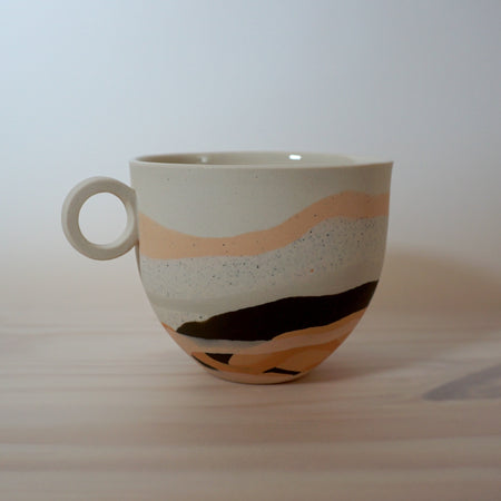 layered mug on a table. 