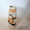 slipcast porcelain vase in shades of orange and brown. 