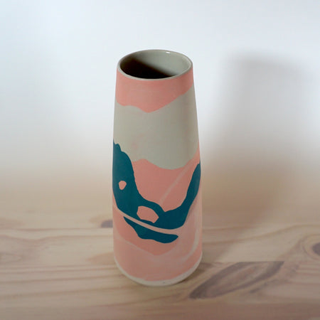 porcelain vase in shades of pink and teal handmade by Anna Jones Ceramics. 