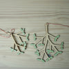 plywood Mistletoe Christmas Decoration from Anna Wiscombe - lying flat