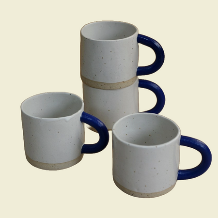 Stack of sophie Alda handmade ceramic mugs with big blue arms | Sophie Alda | Kentish Town Stores 