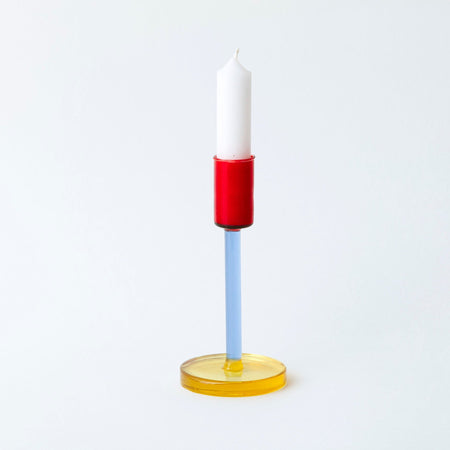 coloured glass candlestick holder on white background