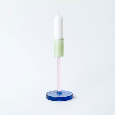 coloured glass candlestick holder on white background