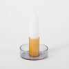 smoked and yellow candlestick holder on white background. 