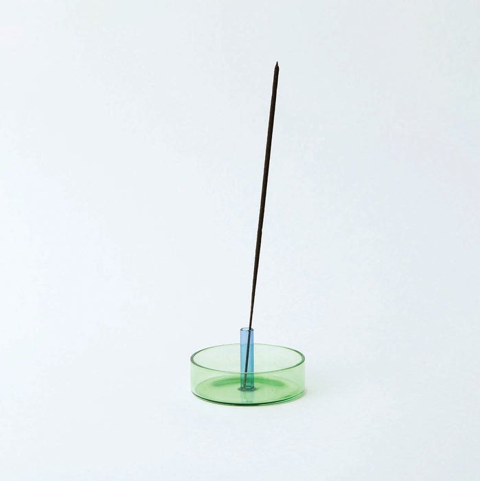 coloured glass incense holder on white background  