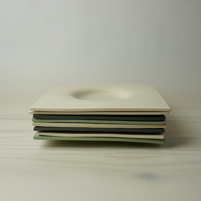 stack of Minimal dimple platter handmade by Brutes Ceramics. 