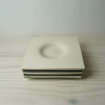 Stack of Minimal dimple platter handmade by Brutes Ceramics. 