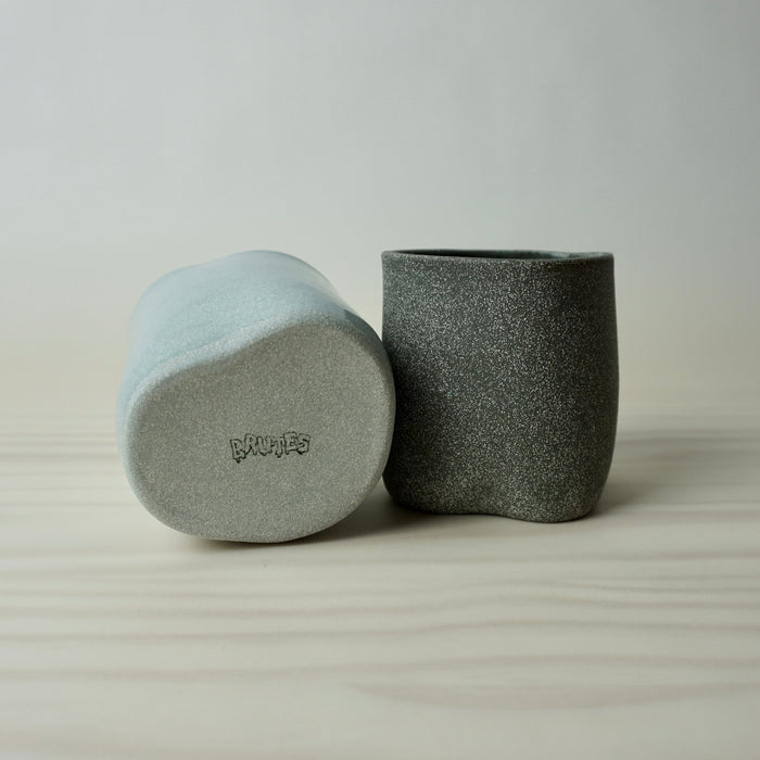 makers mark on the base of two irregular handmade Echo tumblers by brutes ceramics. 