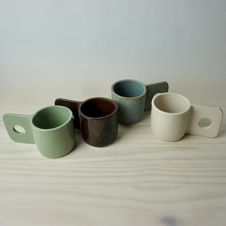 Group of handmade slab built ceramic Hopper Mugs by Brutes. 