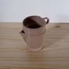 a handmade stackable cup and jug in dusty pink