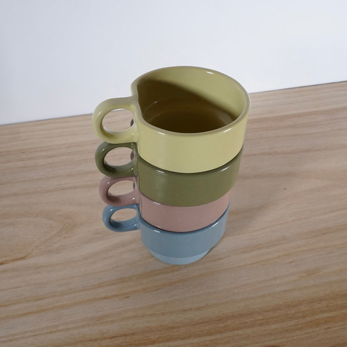 stack of four multi coloured handmade cups by emma johnson ceramics. 