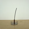 a charcoal incense stick from Evermore London in a glass incense holder by Block Design. 