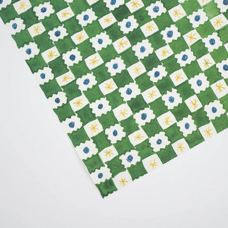 geometric green, blue, yellow and white gift wrap on a white background by Hadley Paper Goods. 