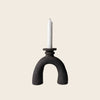 Small handmade sculptural black candlestick holder by HoodMor Ceramics in a black textured clay. 