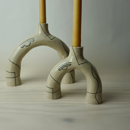 Sculptural candlestick holder in a cream stoneware with line drawing by HoodMor Studio. 