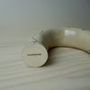 Sculptural candlestick holder in a cream stoneware with line drawing by HoodMor Studio. Bottom of a leg with the makers mark. 