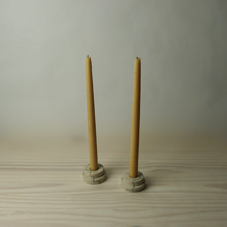 simple tiered candlestick holder in a cream stoneware with line drawing by HoodMor Studio. 