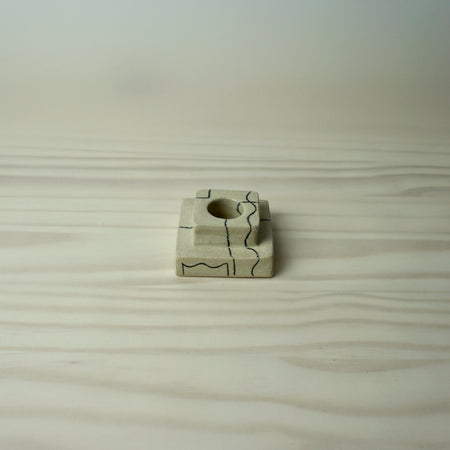 simple square tiered candlestick holder in a cream stoneware with line drawing by HoodMor Studio. 