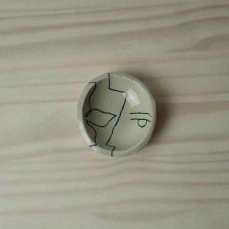 handmade ceramic trinket dish by HoodMor with signature line drawing. 