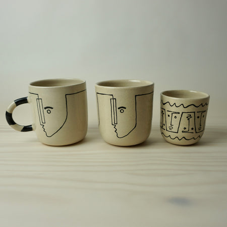 line up of ceramics mugs and tumblers by HoodMor Studio
