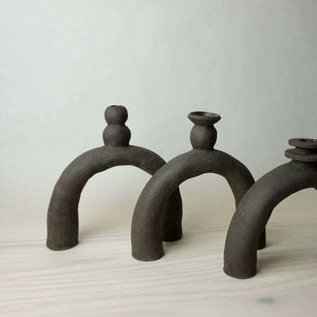 three large leggy candlestick holders, handmade in black clay by HoodMor