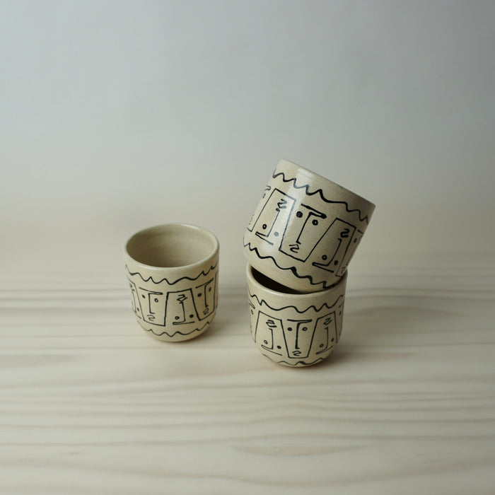 Small Crowd Tumbler handmade ceramics by HoodMor Studio. In a stack three tumblers. 