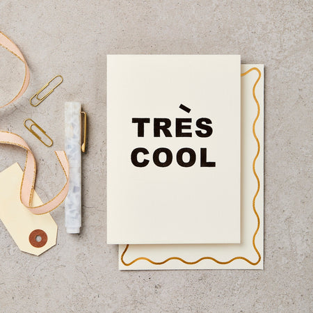 black and white greetings card that says "Tres Cool" 