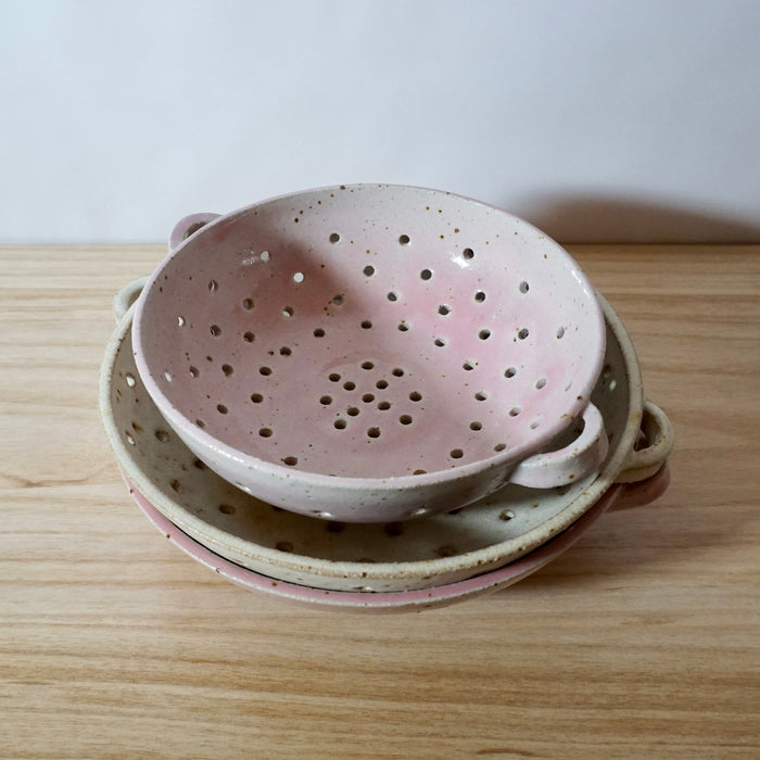 Mae Ceramics handmade colanders in pink and chalk. 