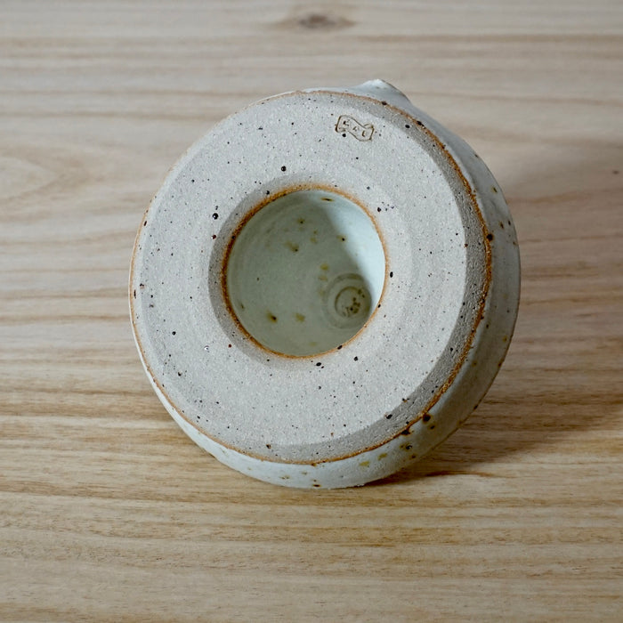 base of a chalk coloured Lemon Squeezer handmade by Mae Ceramics. 