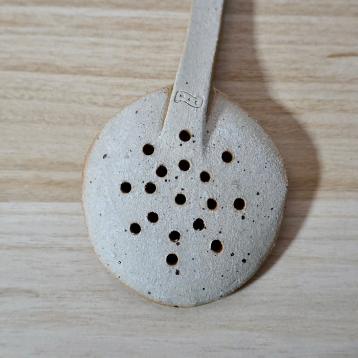 back of a handmade spoon by Mae Ceramics showing the makers mark. 