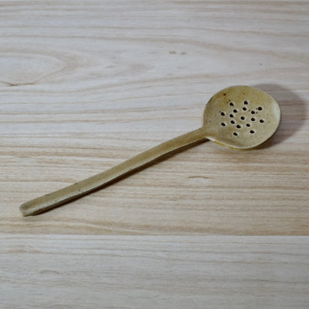 Honey coloured handmade spoon by Mae Ceramics