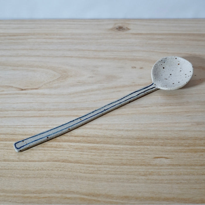 long handmade spoon with line detail by Mae Ceramics