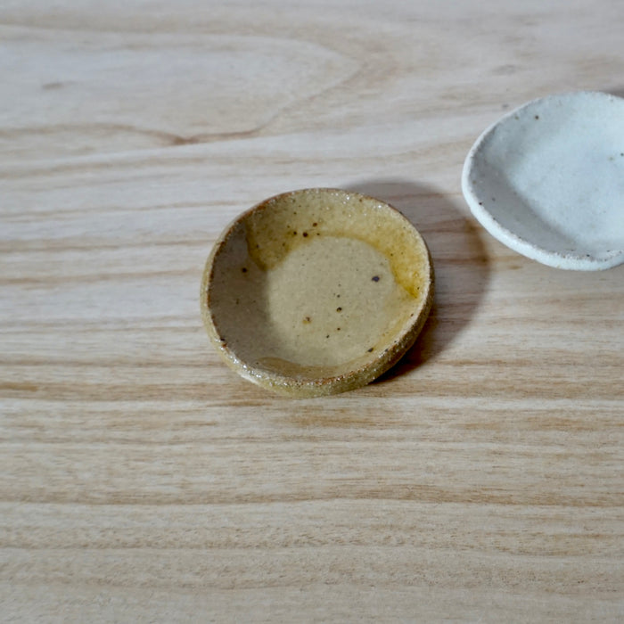 honey coloured tiny wonky dish by mae ceramics. 