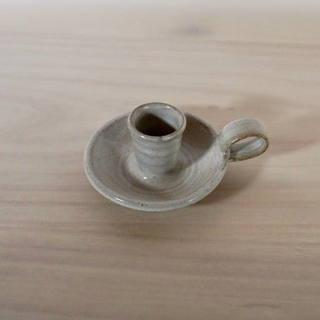 handmade candleholder with a handle in a white glaze by Lily Pearmain ceramics. 