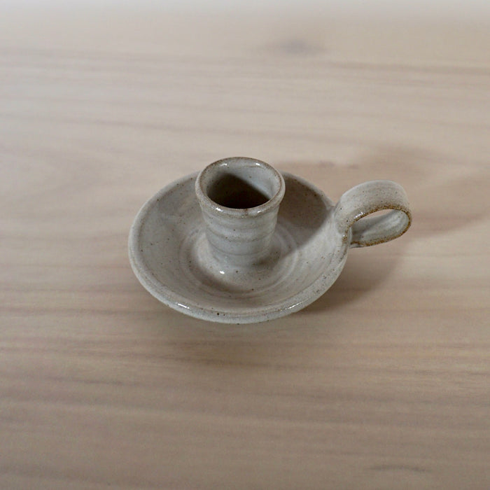 handmade candleholder with a handle in a white glaze by Lily Pearmain ceramics. 