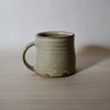 hand thrown mug by lily Pearmain ceramics in a Oat glaze