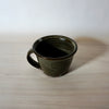 hand thrown mug by lily Pearmain ceramics in a Oat glaze over a red clay