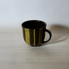 hand thrown mug by lily Pearmain ceramics in a nicotine glaze with porcelain slip stripes 