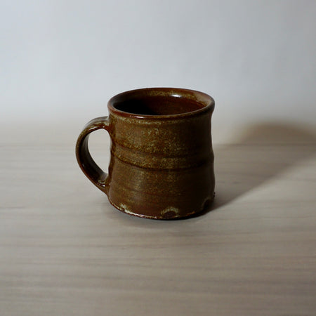 hand thrown mug by lily Pearmain ceramics in a iron rich glaze