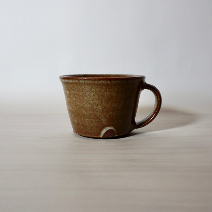 hand thrown mug by lily Pearmain ceramics in a iron rich glaze on a red clay