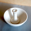 a white stoneware pestle & mortar