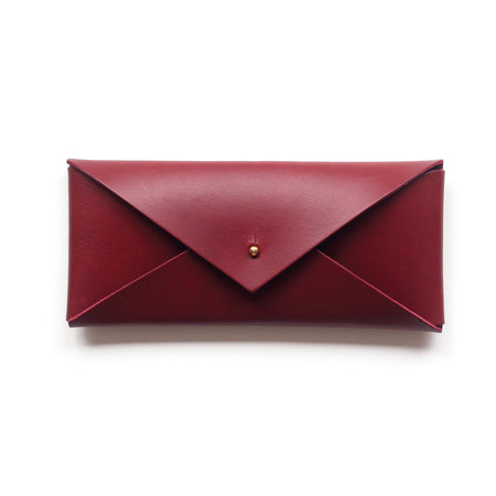 red leather envelope or glasses case on a white background. 