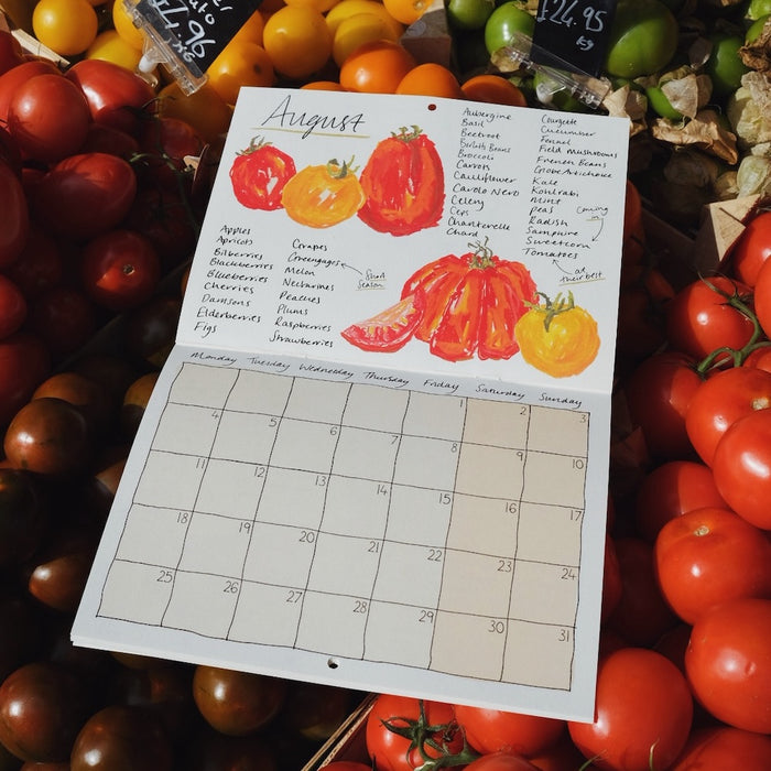 the page for August in a 2025 seasonal eating calendar with nice illustrations of tomatoes. 