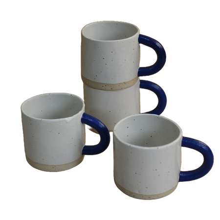 Stack of sophie Alda handmade ceramic mugs with big blue arms. 