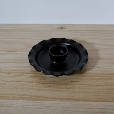 dark matte black olive dish on a table. 