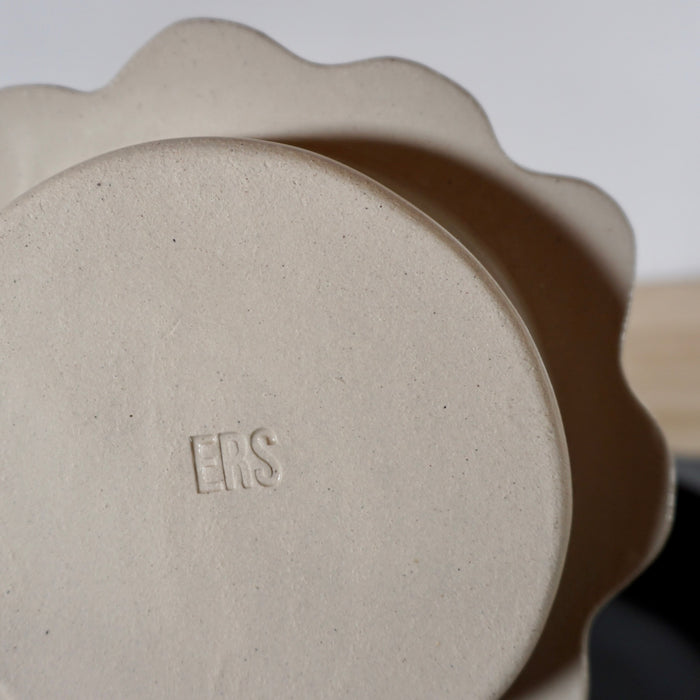 base of a handmade ceramic serving dish with the makers mark of Studio ERS. 