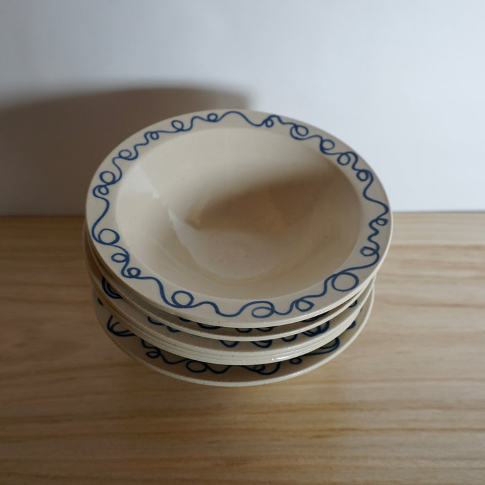 stack of 6 handmade pasta bowls with blue design by Studio ERS. 